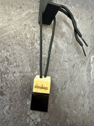 Full image Wildwood Ritual Abundance 8ml glass car diffuser with engraved wooden cap and adjustable black hanging cord.